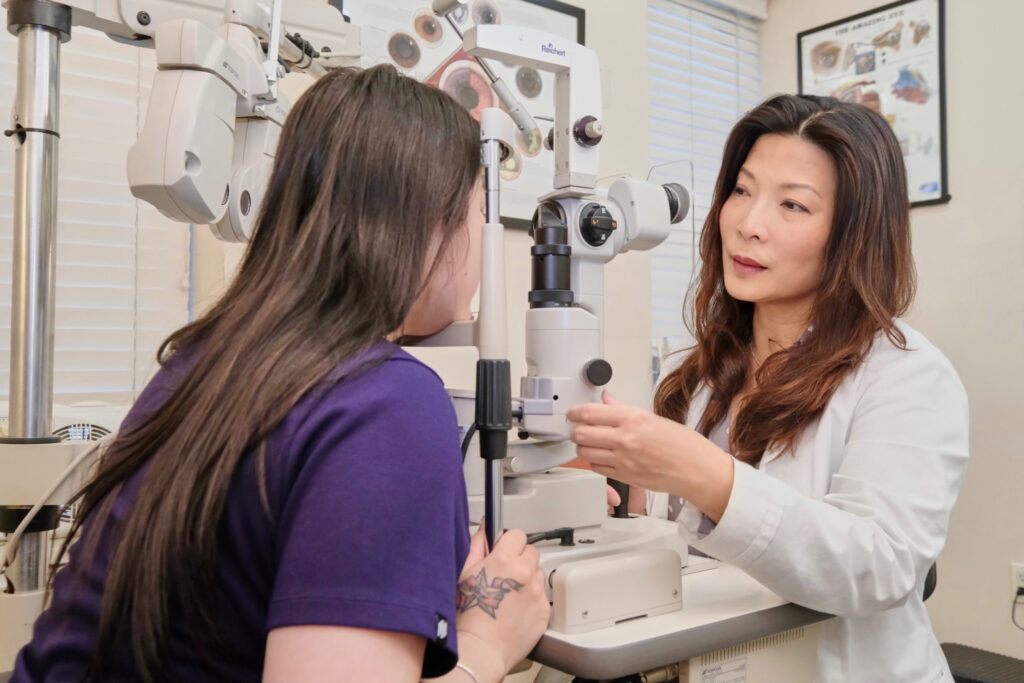 Photo of Dr. Chen and a patient during an eye exam