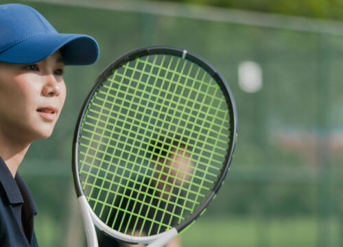 Photo of a woman playing tennis