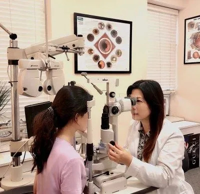 Photo of Dr. Chen with a patient